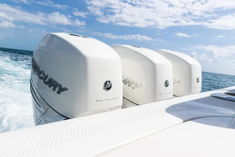 Slide: The Image of Triple Mercury outboard engines on a 2022 SeaVee 370z boat in open water. - 20