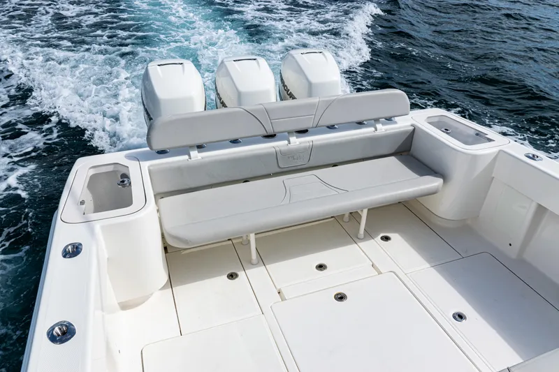Slide: The Image of 2022 SeaVee 370z boat with triple engines, spacious deck, and comfortable seating. - 21