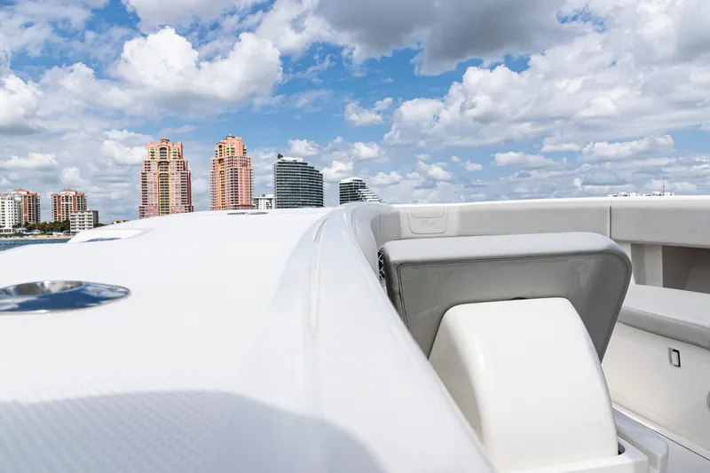 Slide: The Image of 2022 SeaVee 370z boat deck with city skyline and cloudy sky. - 29