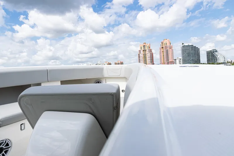 Slide: The Image of 2022 SeaVee 370z boat with city skyline and cloudy sky background. - 30