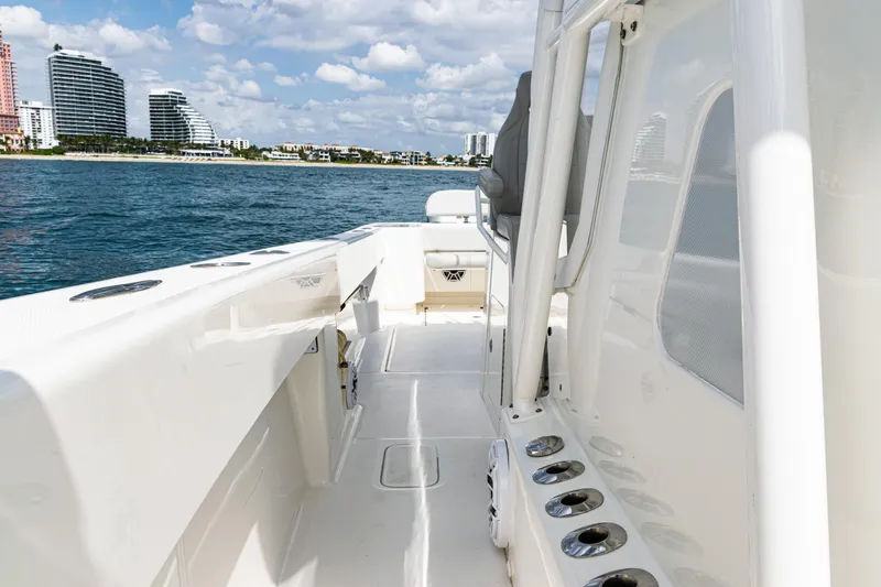 Slide: The Image of 2022 SeaVee 370z boat on water with city skyline in background. - 31