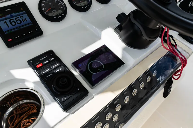 Slide: The Image of Control panel of 2022 SeaVee 370z boat with navigation instruments and gauges. - 36