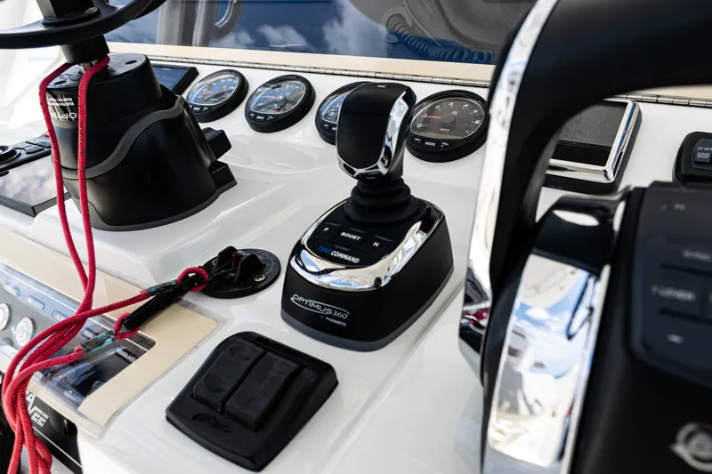Slide: The Image of Control panel of a 2022 SeaVee 370z boat with joystick and gauges. - 38