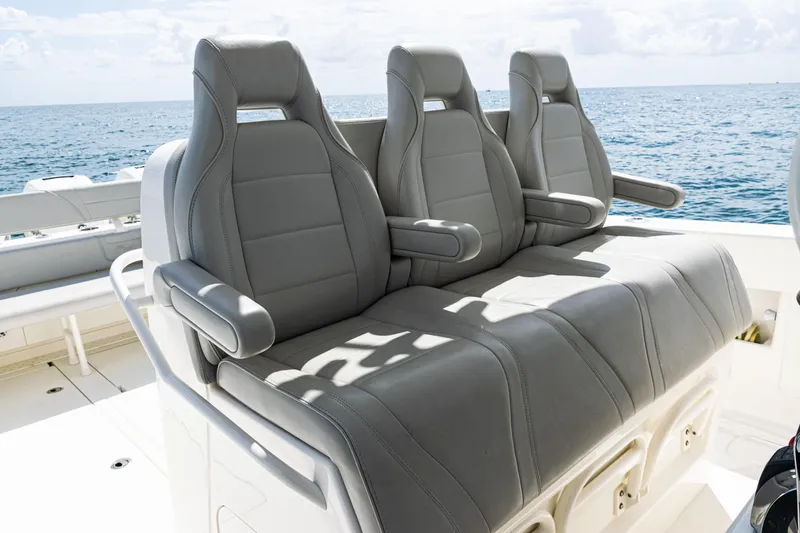 Slide: The Image of Three gray seats on a 2022 SeaVee 370z boat, overlooking the ocean. - 39