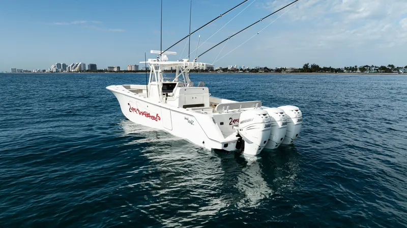 Slide: The Image of 2022 SeaVee 370z boat with triple engines on open water. - 44