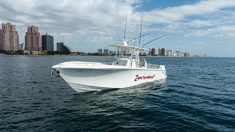 Slide: The Image of 2022 SeaVee 370z boat cruising on ocean near city skyline. - 48