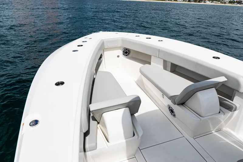 Slide: The Image of 2022 SeaVee 370z boat with spacious seating, cruising on calm waters. - 5