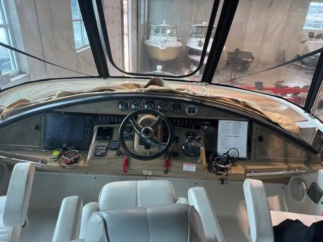Slide: The Image of Interior cockpit of a 2003 Carver 360 Sport Sedan with navigation instruments and steering wheel. - 12