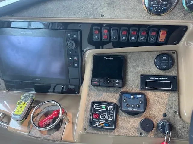 Slide: The Image of Dashboard of a 2003 Carver 360 Sport Sedan with navigation and control panels. - 16