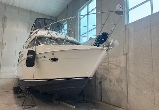 Slide: The Image of 2003 Carver 360 Sport Sedan yacht in indoor storage, side view. - 2