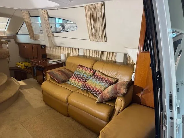 Slide: The Image of Interior of 2003 Carver 360 Sport Sedan with leather sofa and colorful cushions. - 23