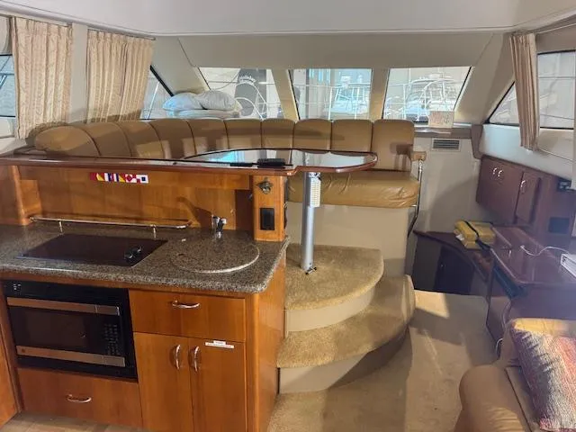 Slide: The Image of Interior of 2003 Carver 360 Sport Sedan with kitchen and seating area. - 26