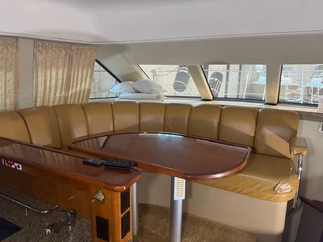 Slide: The Image of Interior of 2003 Carver 360 Sport Sedan with leather seating and wooden table. - 28