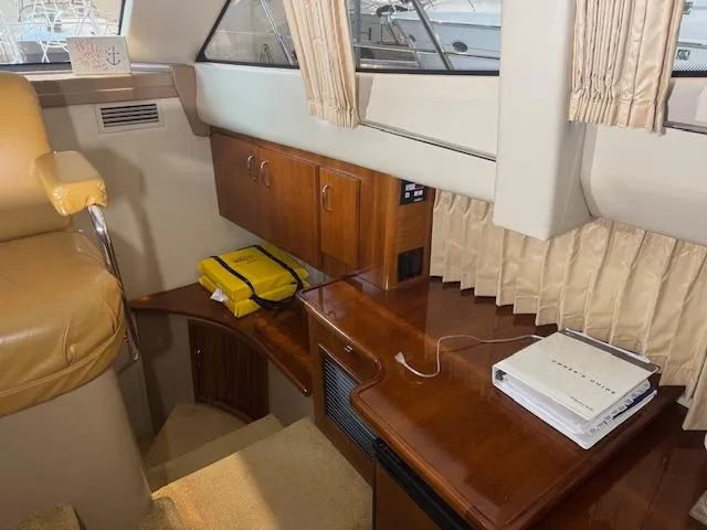 Slide: The Image of Interior of 2003 Carver 360 Sport Sedan with wood cabinetry and seating. - 29