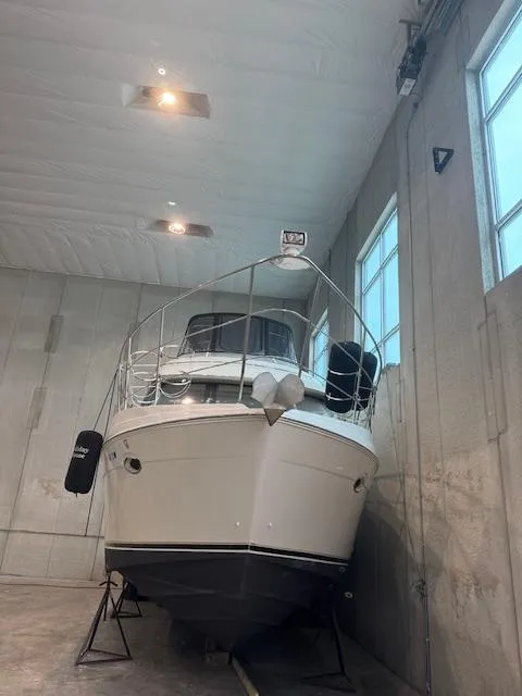 Slide: The Image of 2003 Carver 360 Sport Sedan yacht stored indoors, front view. - 3