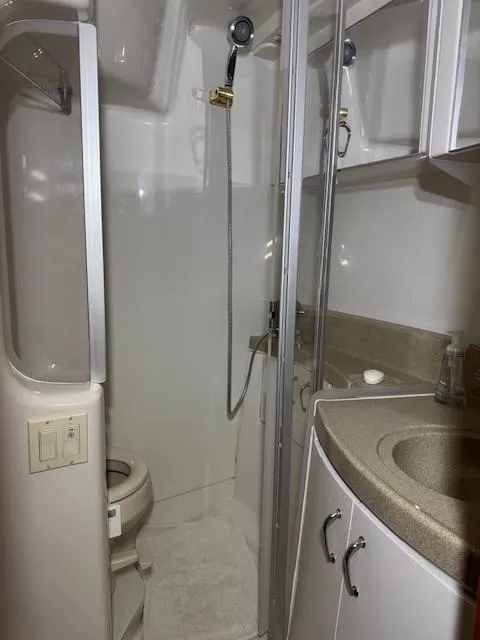 Slide: The Image of Bathroom interior of a 2003 Carver 360 Sport Sedan yacht, featuring shower and sink. - 36