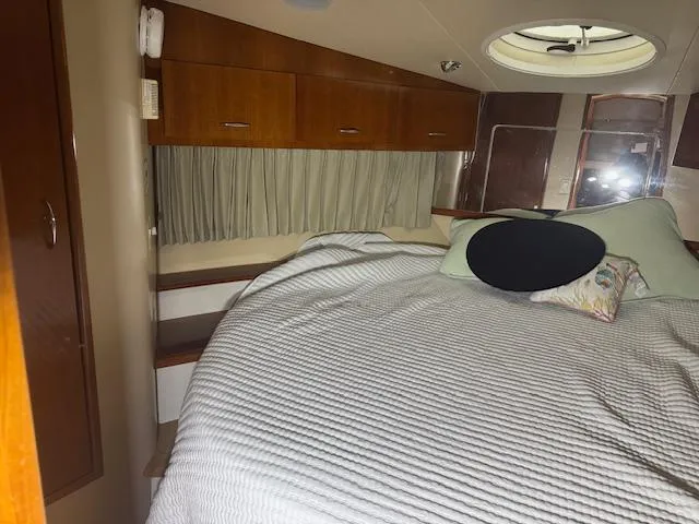 Slide: The Image of Interior cabin of 2003 Carver 360 Sport Sedan with bed and storage cabinets. - 37