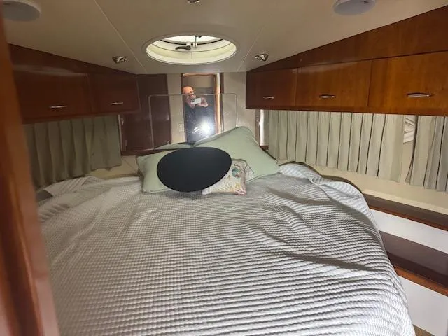 Slide: The Image of Interior cabin of 2003 Carver 360 Sport Sedan with bed and wooden cabinets. - 38