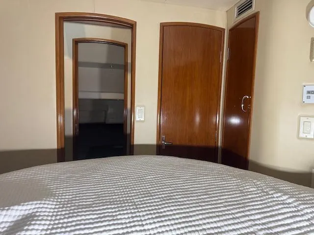 Slide: The Image of Interior view of 2003 Carver 360 Sport Sedan, featuring wooden doors and a cozy cabin space. - 39