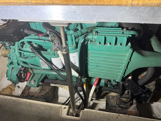 Slide: The Image of Engine compartment of a 2003 Carver 360 Sport Sedan, showcasing mechanical components and wiring. - 43