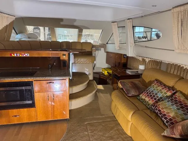 Slide: The Image of Interior of a 2003 Carver 360 Sport Sedan with kitchen and seating area. - 46