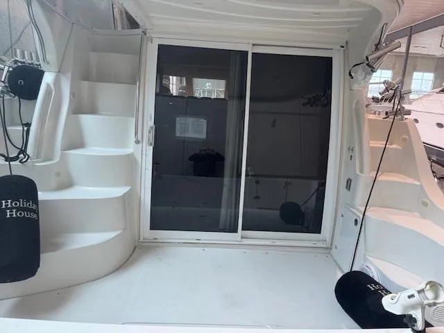 Slide: The Image of 2003 Carver 360 Sport Sedan yacht with sliding glass doors and curved staircase. - 7