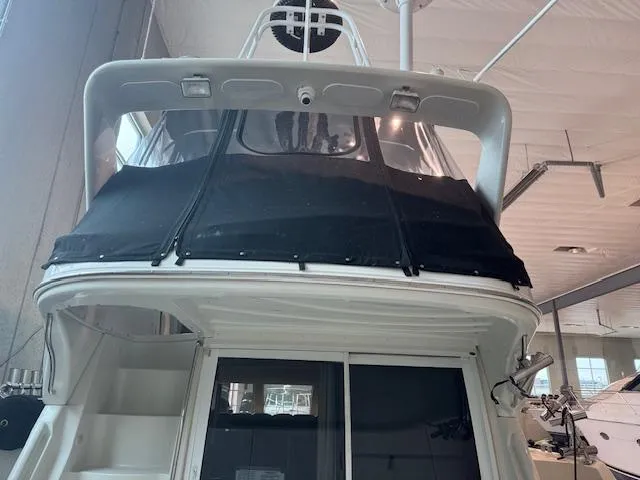 Slide: The Image of 2003 Carver 360 Sport Sedan yacht in indoor storage, rear view. - 8