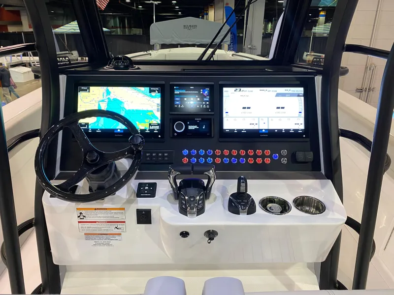 Slide: The Image of 2025 Edgewater 340CC boat dashboard with advanced navigation and control systems. - 15
