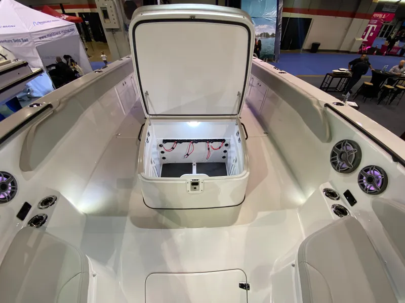 Slide: The Image of 2025 Edgewater 340CC boat interior with open storage compartment, showcasing modern design and features. - 23