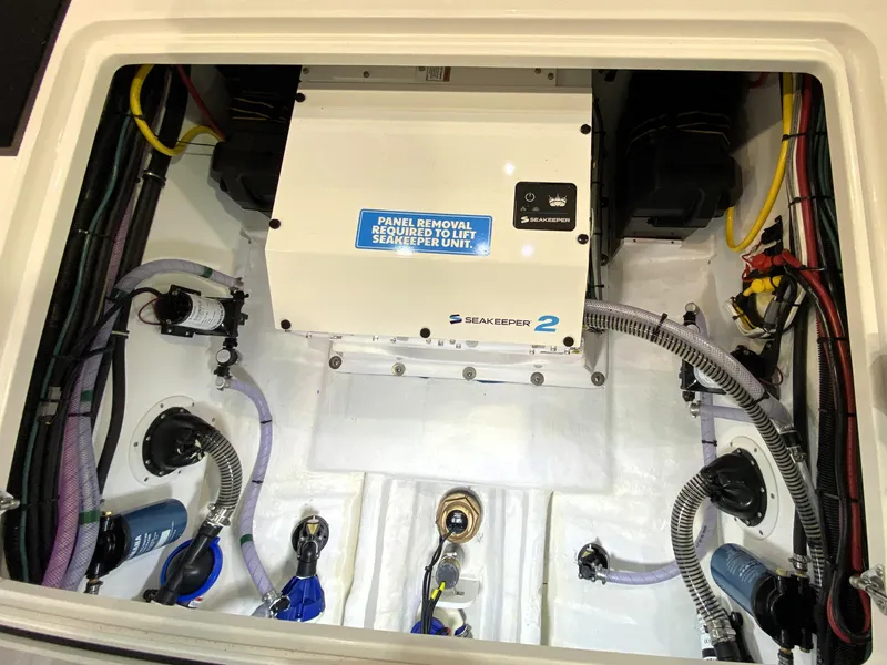 Slide: The Image of Engine compartment of 2025 Edgewater 340CC boat with Seakeeper 2 stabilization system. - 30