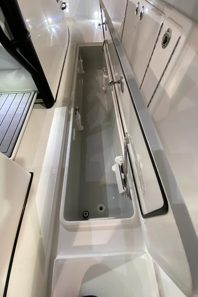 Slide: The Image of 2025 Edgewater 340CC boat interior storage compartment, sleek design, spacious layout. - 37
