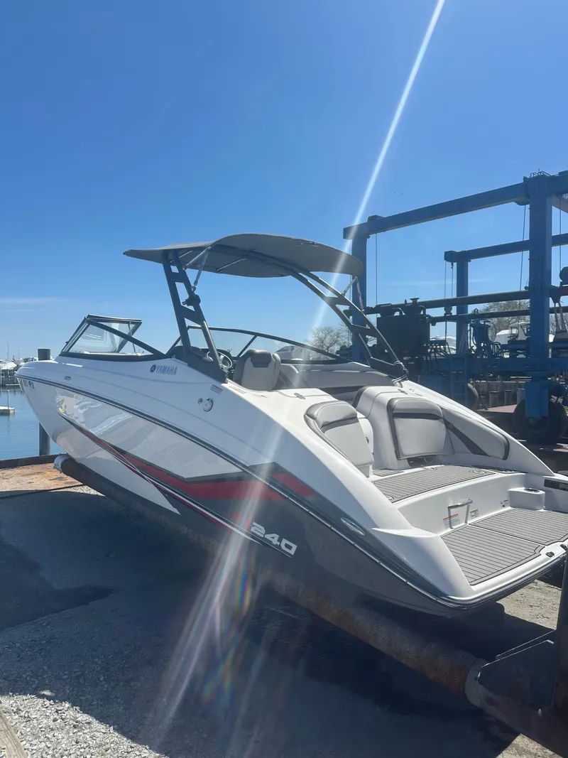 Slide: The Image of 2019 Yamaha AR240 boat on trailer under clear blue sky. - 4