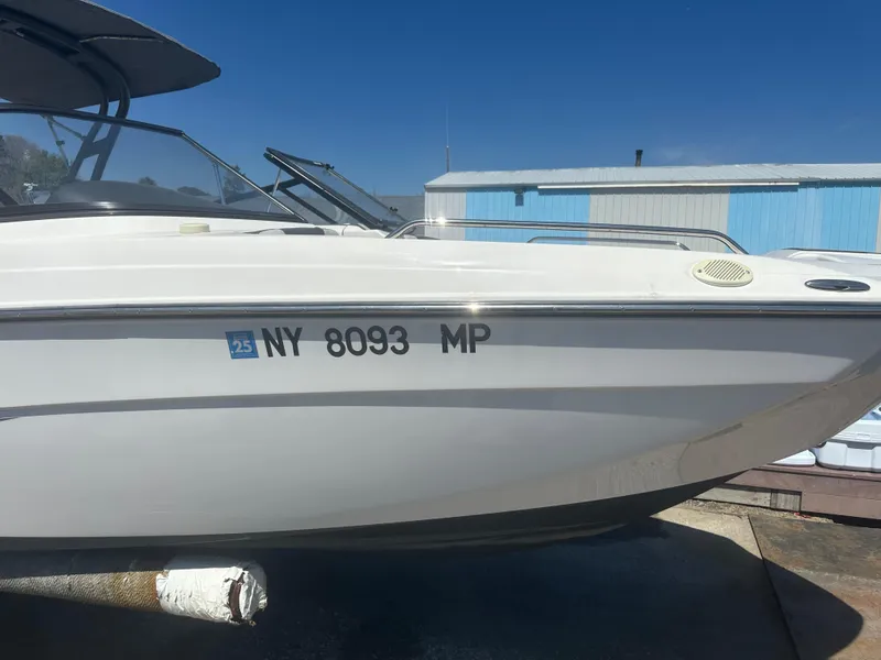 Slide: The Image of 2019 Yamaha Boats AR240 with registration NY 8093 MP, docked under clear blue sky. - 7