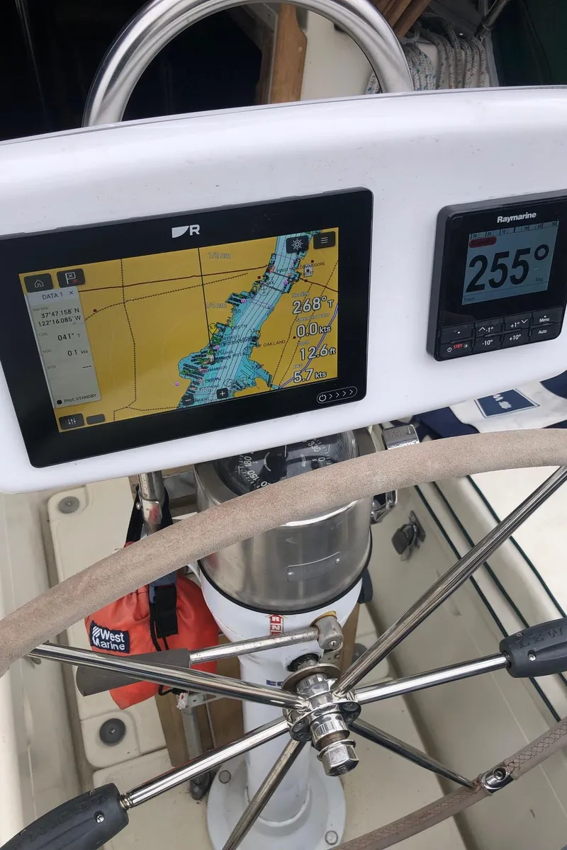 Slide: The Image of Steering wheel and navigation system on 1992 Pacific Seacraft 34 Crealock sailboat. - 21