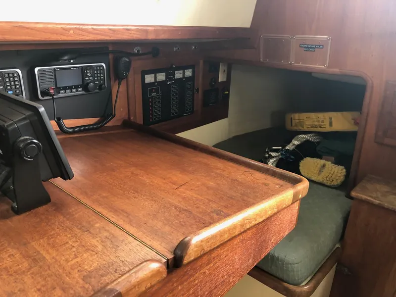 Slide: The Image of Interior of 1992 Pacific Seacraft 34 Crealock sailboat with navigation equipment and cozy berth. - 4