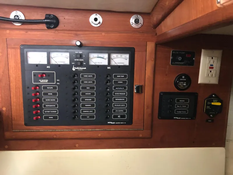 Slide: The Image of Electrical panel of a 1992 Pacific Seacraft 34 Crealock sailboat, featuring AC and DC controls. - 6