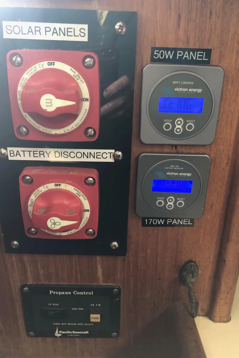 Slide: The Image of Control panel of a 1992 Pacific Seacraft 34 Crealock sailboat with solar and battery switches. - 7