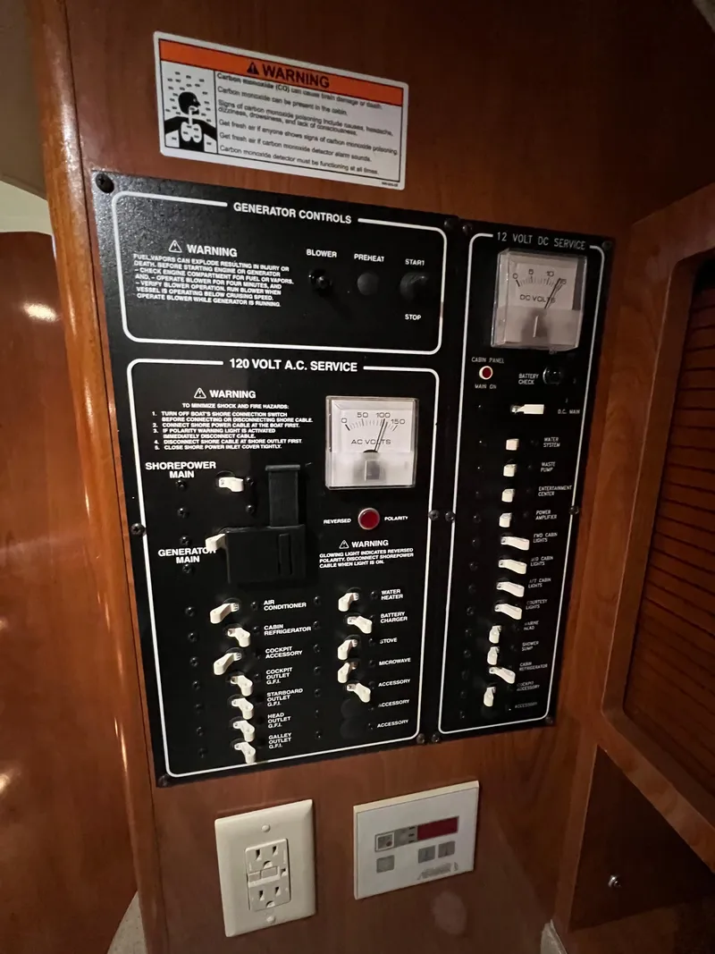 Slide: The Image of Electrical control panel on a 2007 Larson Cabrio 330 boat interior. - 13