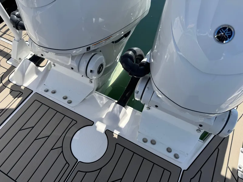 Slide: The Image of 2025 Cutwater C-288 Coupe boat engines on a sleek, modern deck. - 11