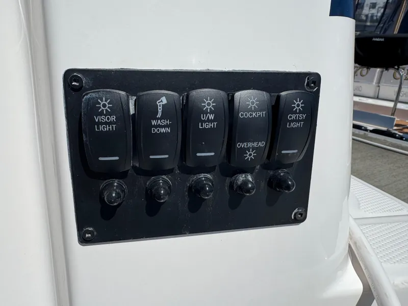 Slide: The Image of Control panel of 2025 Cutwater C-288 Coupe with labeled light switches. - 15