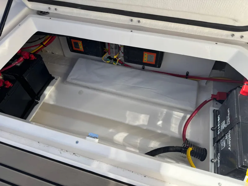 Slide: The Image of Battery compartment of 2025 Cutwater C-288 Coupe with wiring and components. - 17