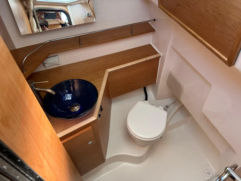 Slide: The Image of 2025 Cutwater C-288 Coupe bathroom with modern sink and toilet. - 29