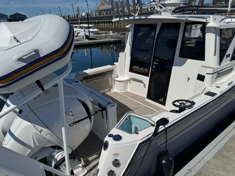 Slide: The Image of 2025 Cutwater C-288 Coupe docked, showcasing sleek design and modern features. - 3