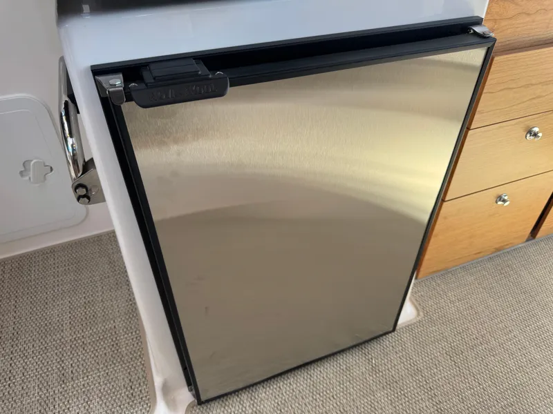 Slide: The Image of Stainless steel refrigerator in 2025 Cutwater C-288 Coupe boat interior. - 32