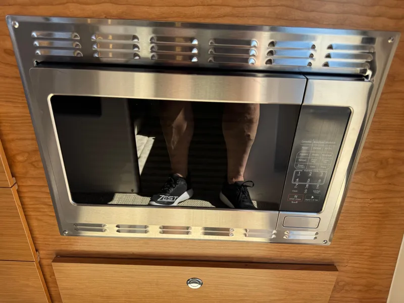 Slide: The Image of Built-in microwave in 2025 Cutwater C-288 Coupe boat interior. - 33