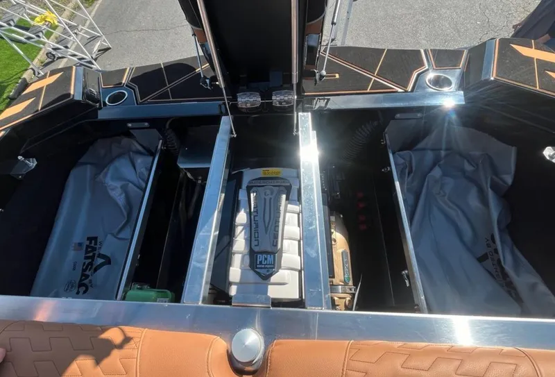 Slide: The Image of 2025 Centurion Ri 265 boat engine compartment with PCM engine and storage areas. - 20
