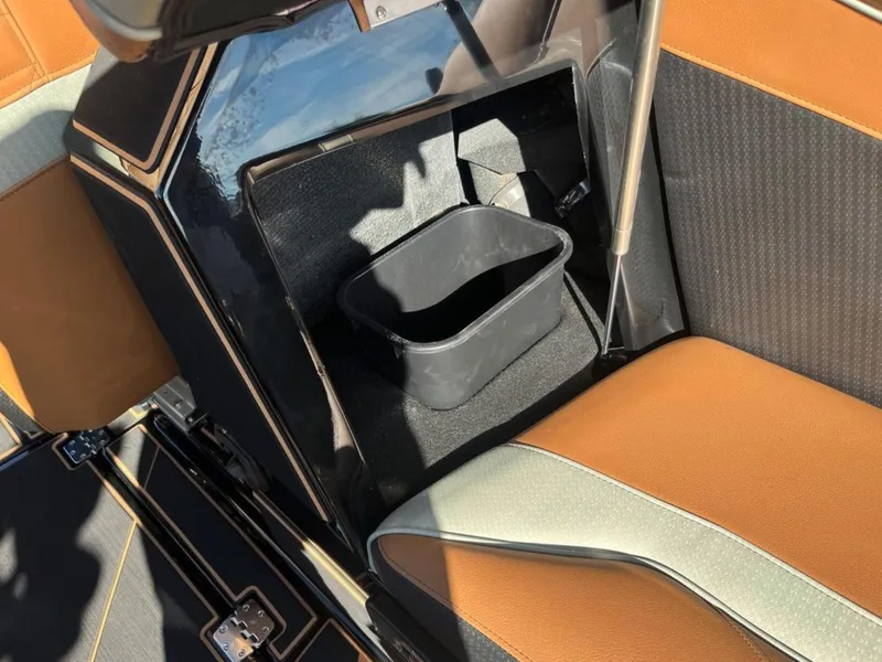 Slide: The Image of Interior of 2025 Centurion Ri 265 boat with storage compartment and seating. - 25