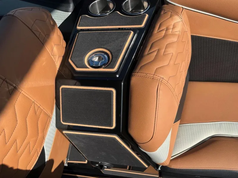 Slide: The Image of Luxurious interior of 2025 Centurion Ri 265 with tan leather and cup holders. - 26