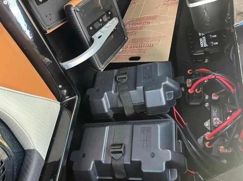 Slide: The Image of Interior view of 2025 Centurion Ri 265 boat showing battery compartments and wiring. - 29