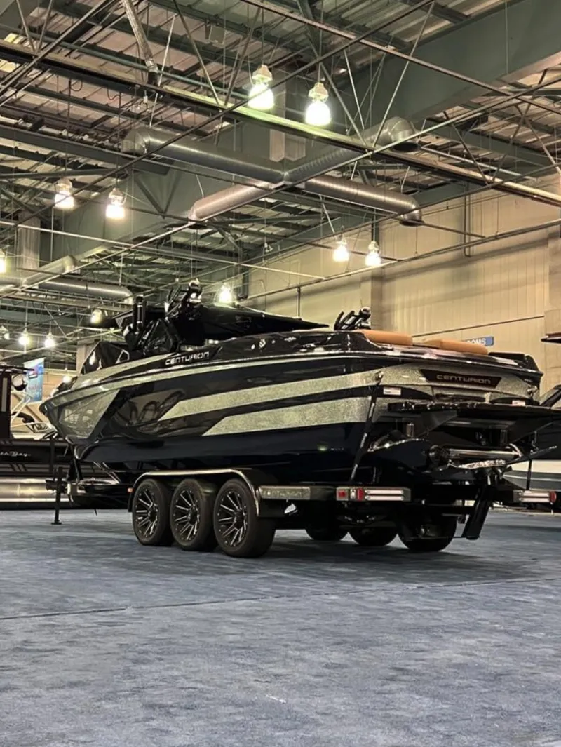 Slide: The Image of 2025 Centurion Ri 265 boat displayed indoors, showcasing sleek design and modern features. - 3